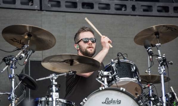 Evan Hadnett plays drums on stage